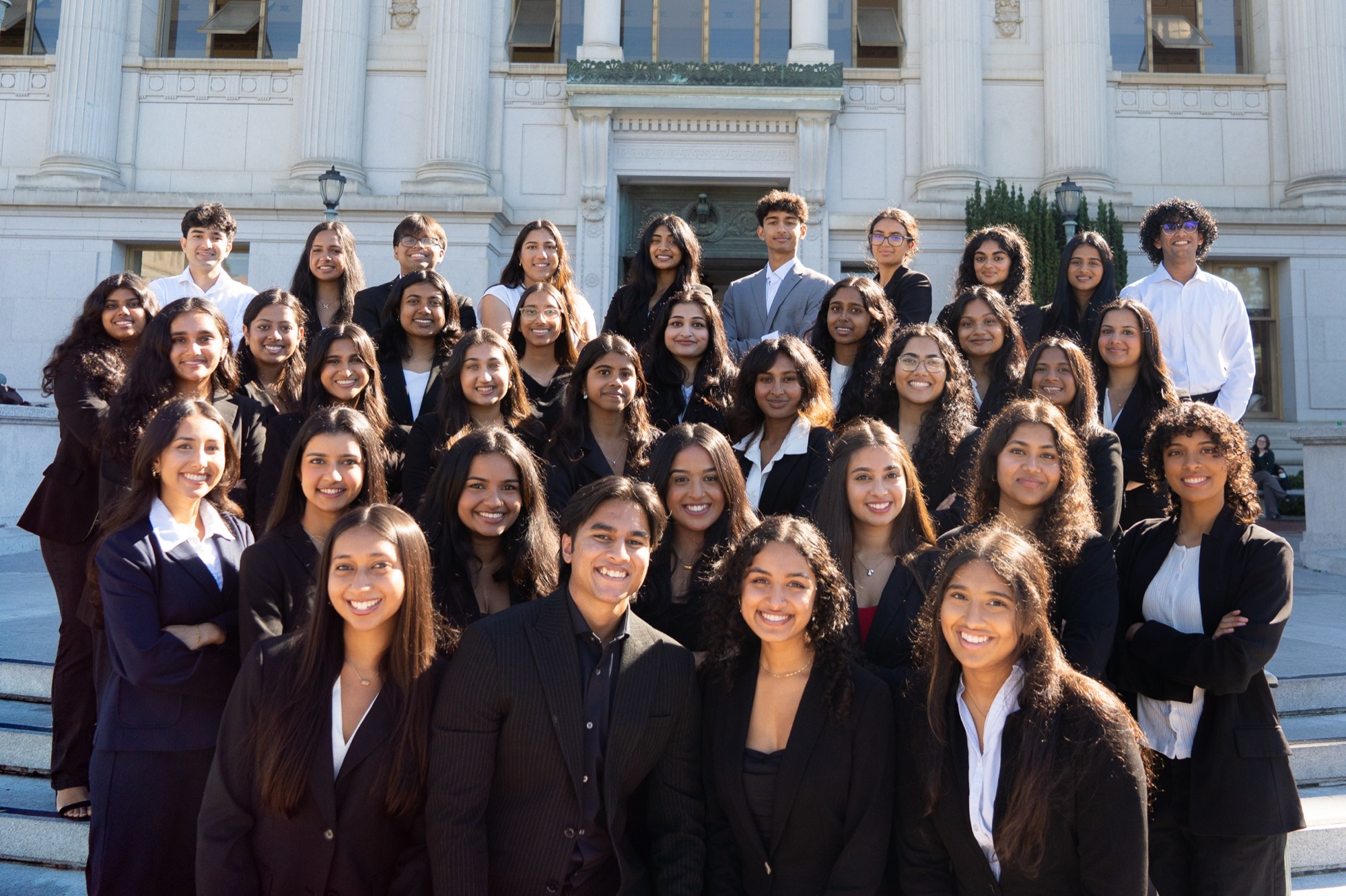 The Asha Berkeley team on the steps of Doe Library